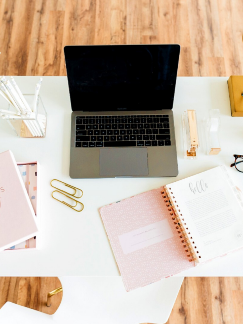 gray and black laptop computer on white table