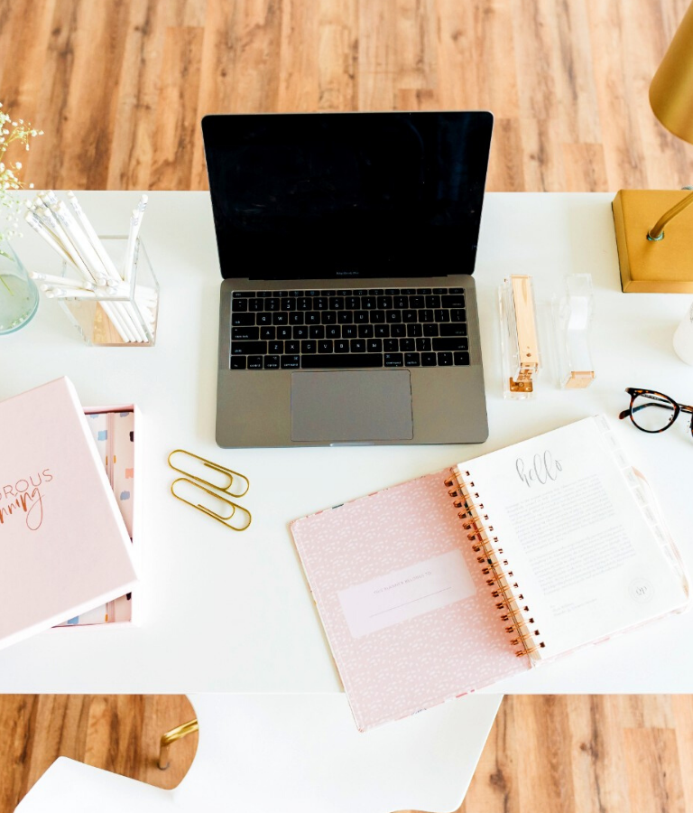 gray and black laptop computer on white table