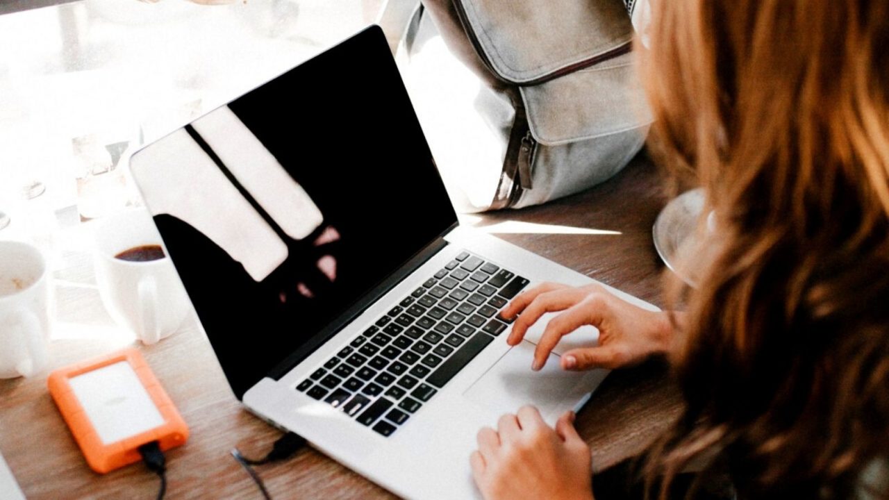 Woman typing on laptop