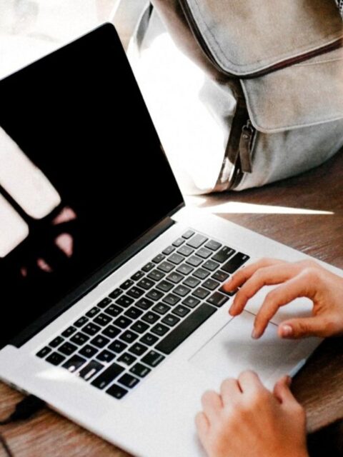 Woman typing on laptop