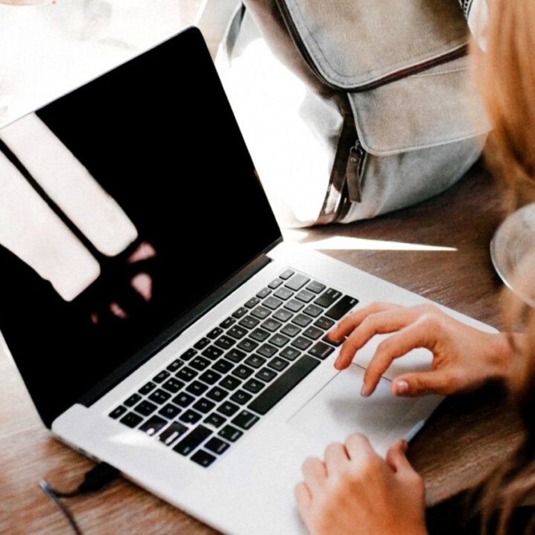 Woman typing on laptop