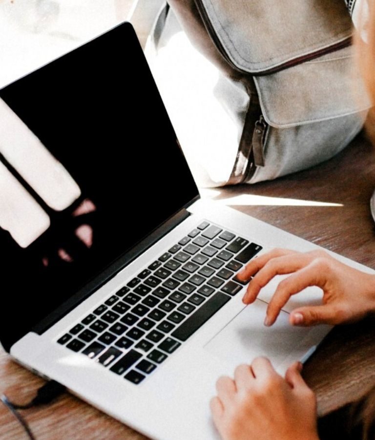 Woman typing on laptop
