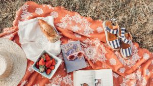 top angle photography of strawberries beside book photo