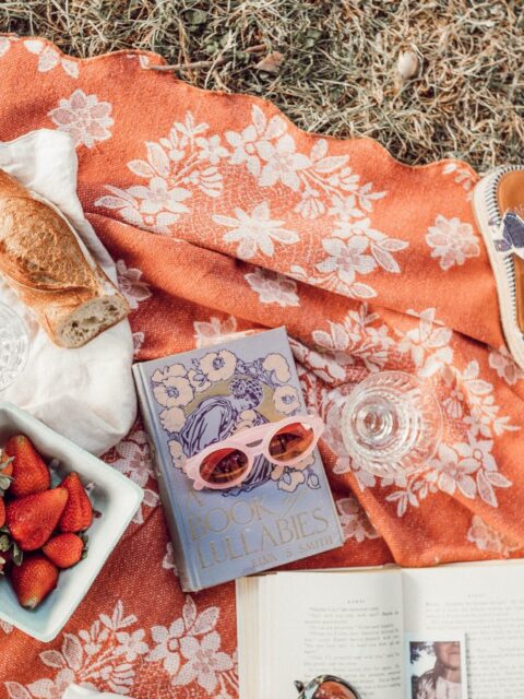 top angle photography of strawberries beside book photo