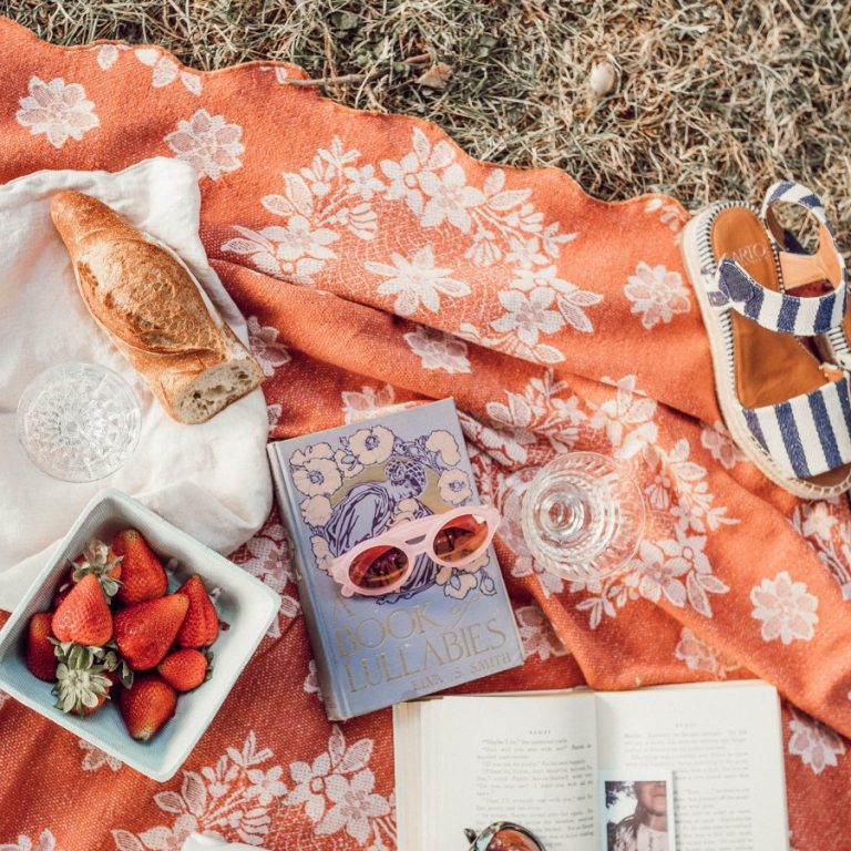 top angle photography of strawberries beside book photo