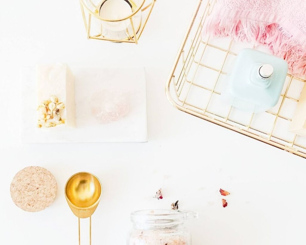 spray bottles on rack beside lamp and dessert photo
