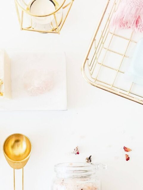 spray bottles on rack beside lamp and dessert photo