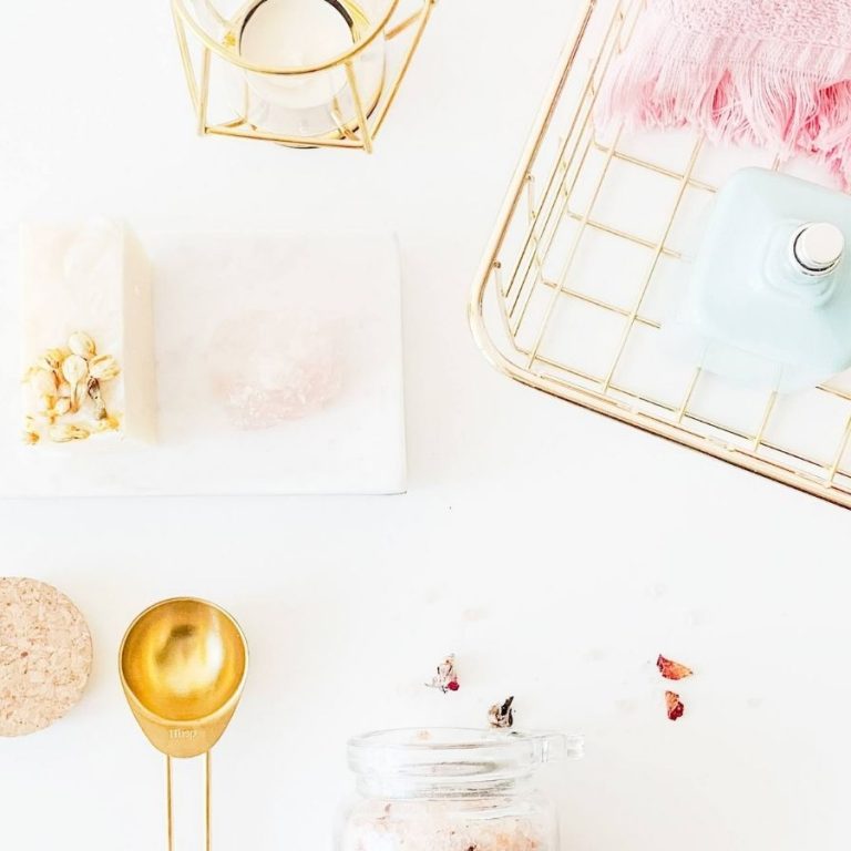 spray bottles on rack beside lamp and dessert photo